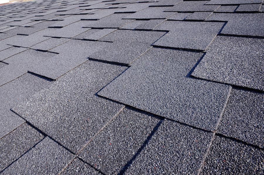 A close up of a roof with shingles on it