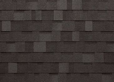 A close up of a roof with black shingles.