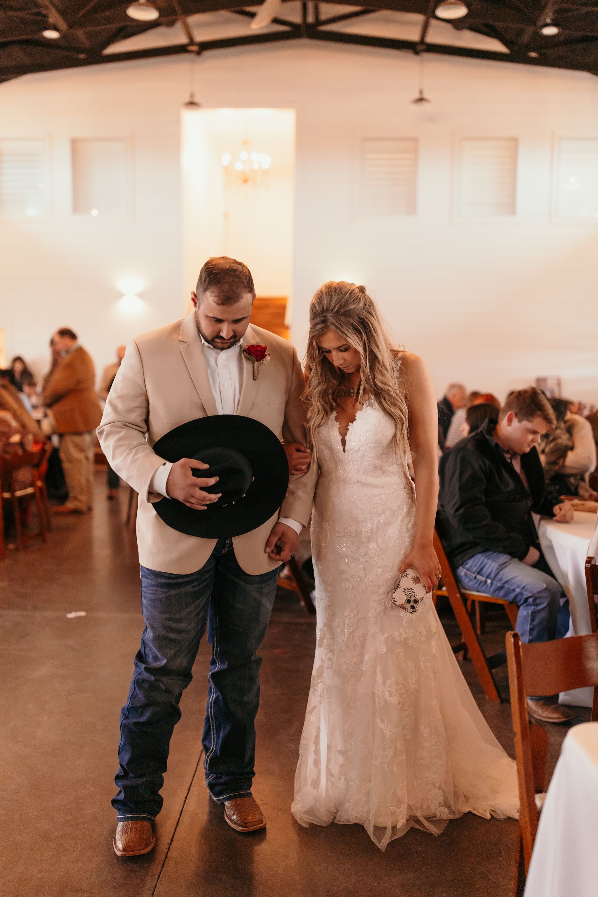 bride and groom praying during wedding ceremony