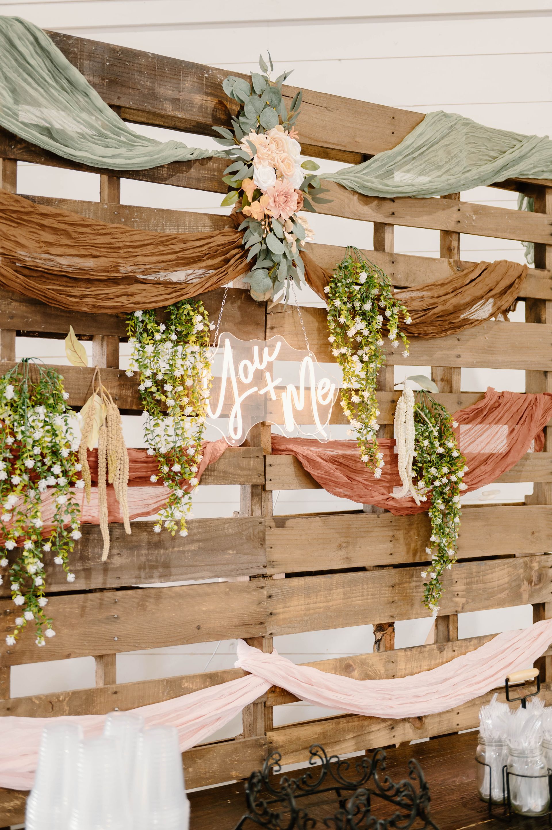you and me neon sign on wooden backdrop