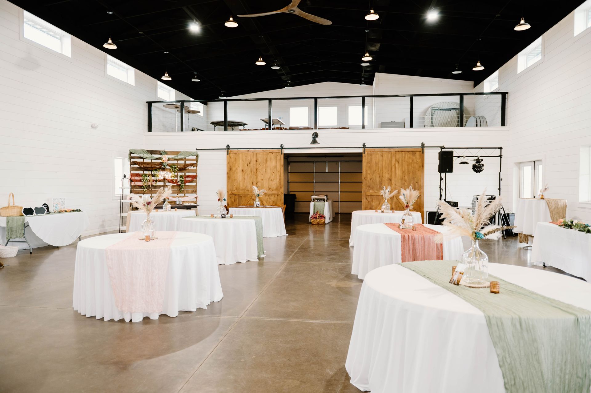 wedding reception tables with pastel pink and green runners