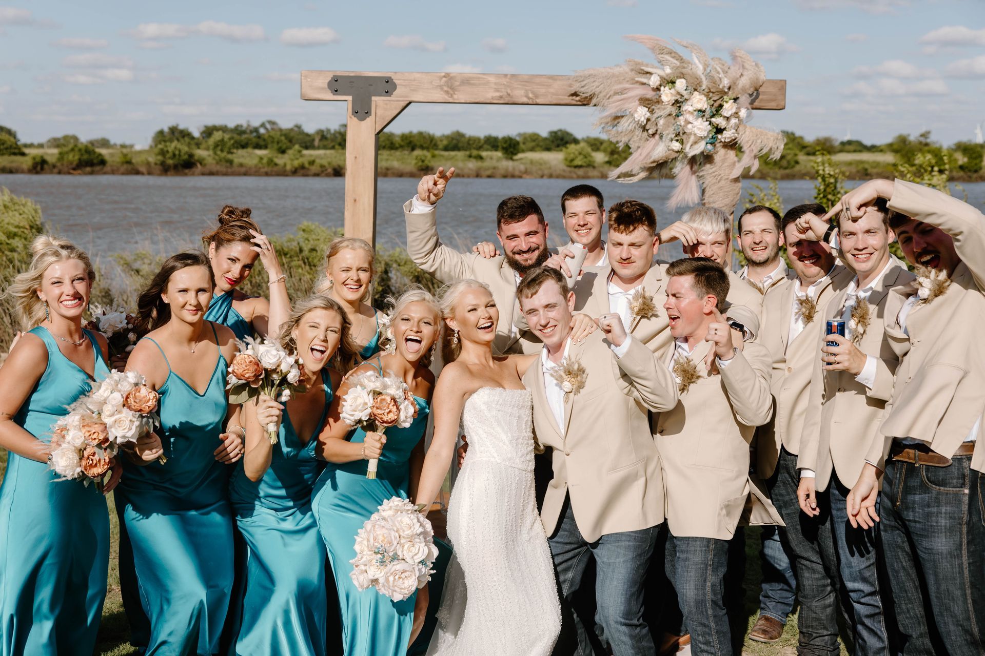 bride and groom with wedding party casual group picture