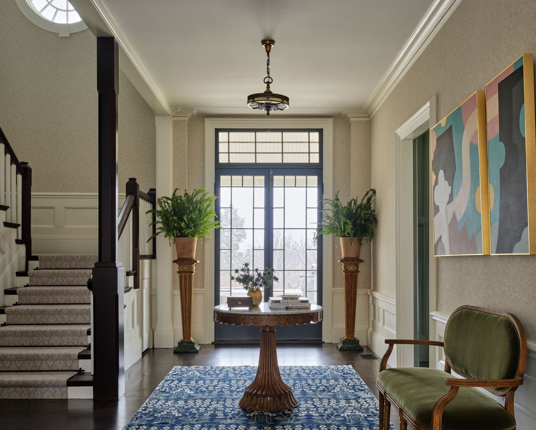 Entryway of a Hawthorn Builders project home with staircase and front door
