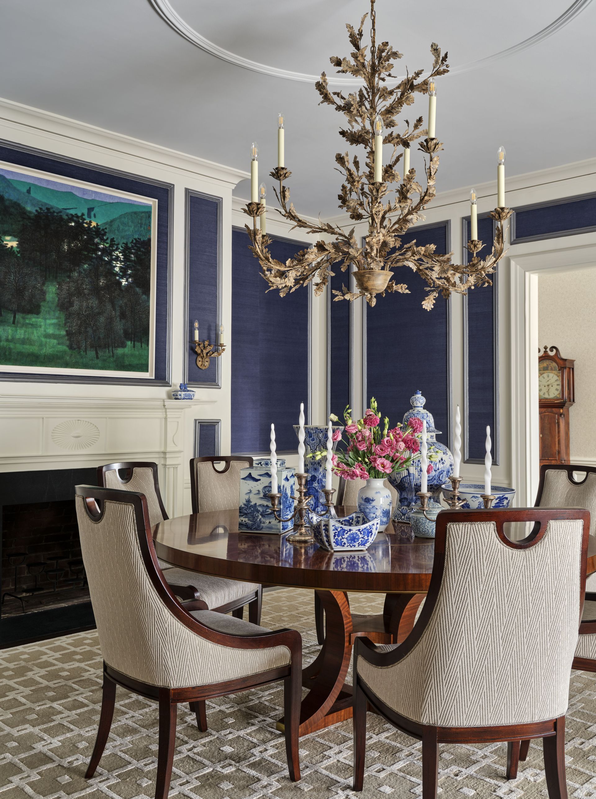 An elegant dining room with a table and chairs and a chandelier