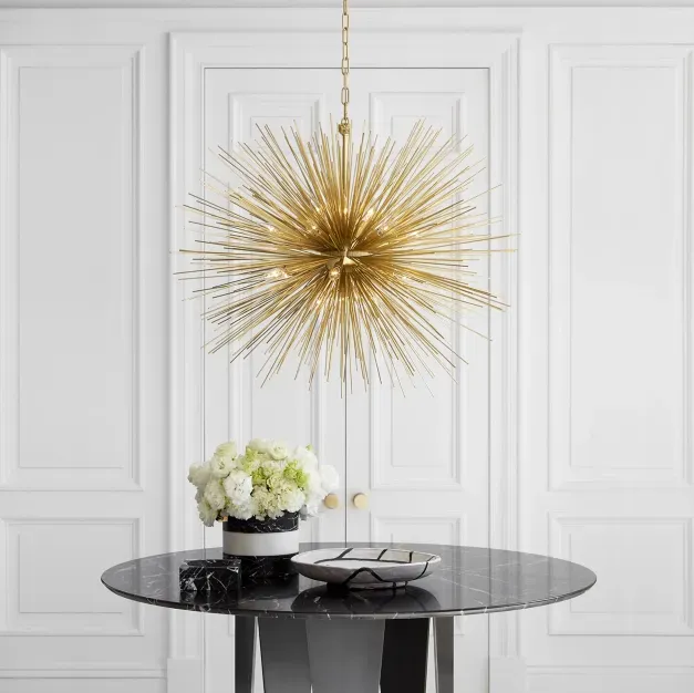 Sleek, minimalist kitchen with handleless cabinets and integrated appliances, showcasing the clean lines trend of 2025.
statement lighting
custom fixtures
ambient light
ambiance
