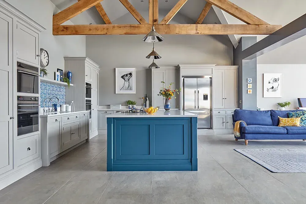 Spacious kitchen island with built-in sink and seating area, illustrating the multifunctional island trend of 2025
expansive kitchen islands;
seamless indoor-outdoor connections
butler's pantry