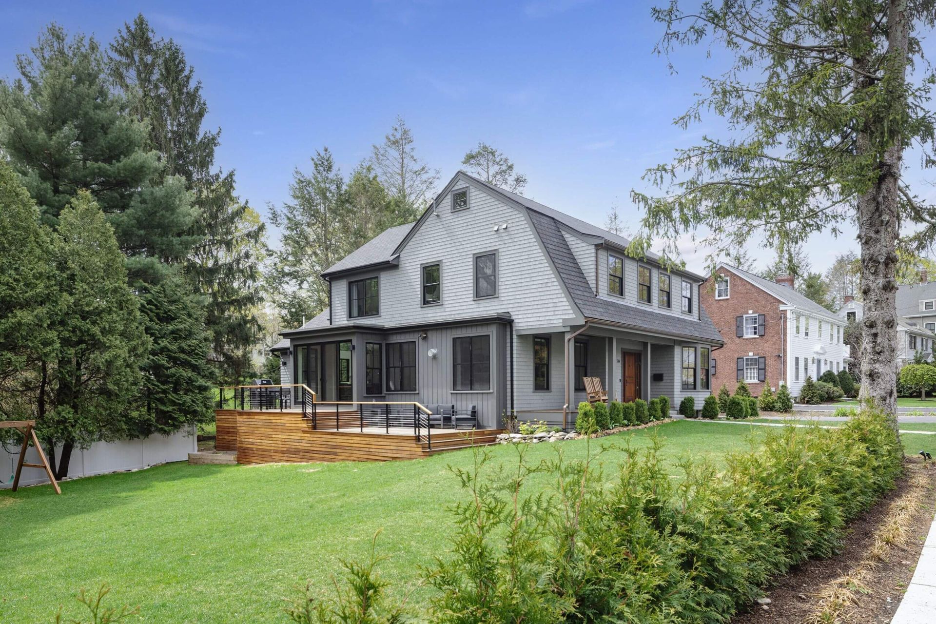 A Craftsman House recently restored, with a green backyard and wooden patio