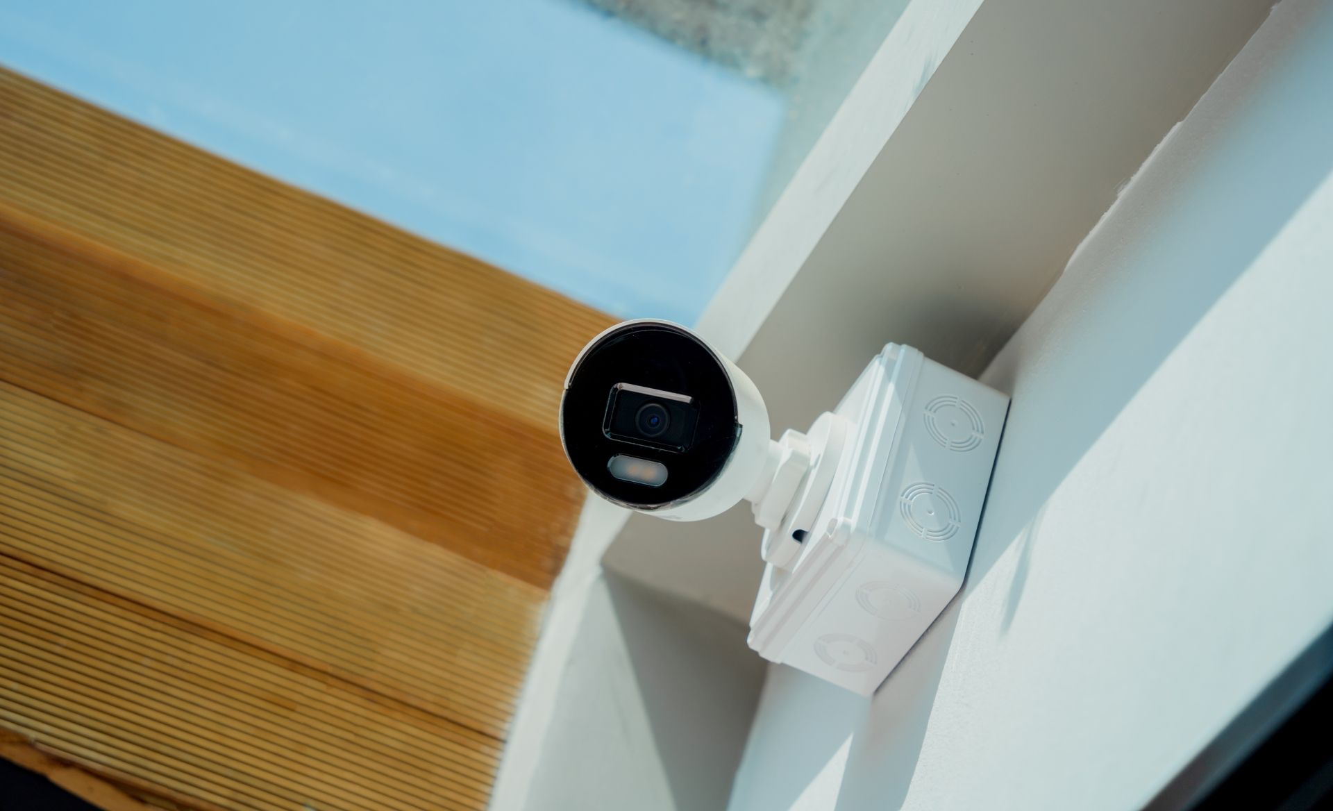 a security camera is mounted on the side of a building.