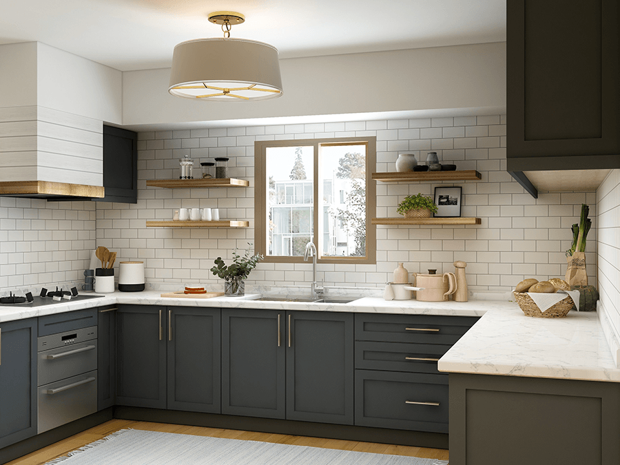 A kitchen with gray cabinets , white counter tops , a sink and a window.