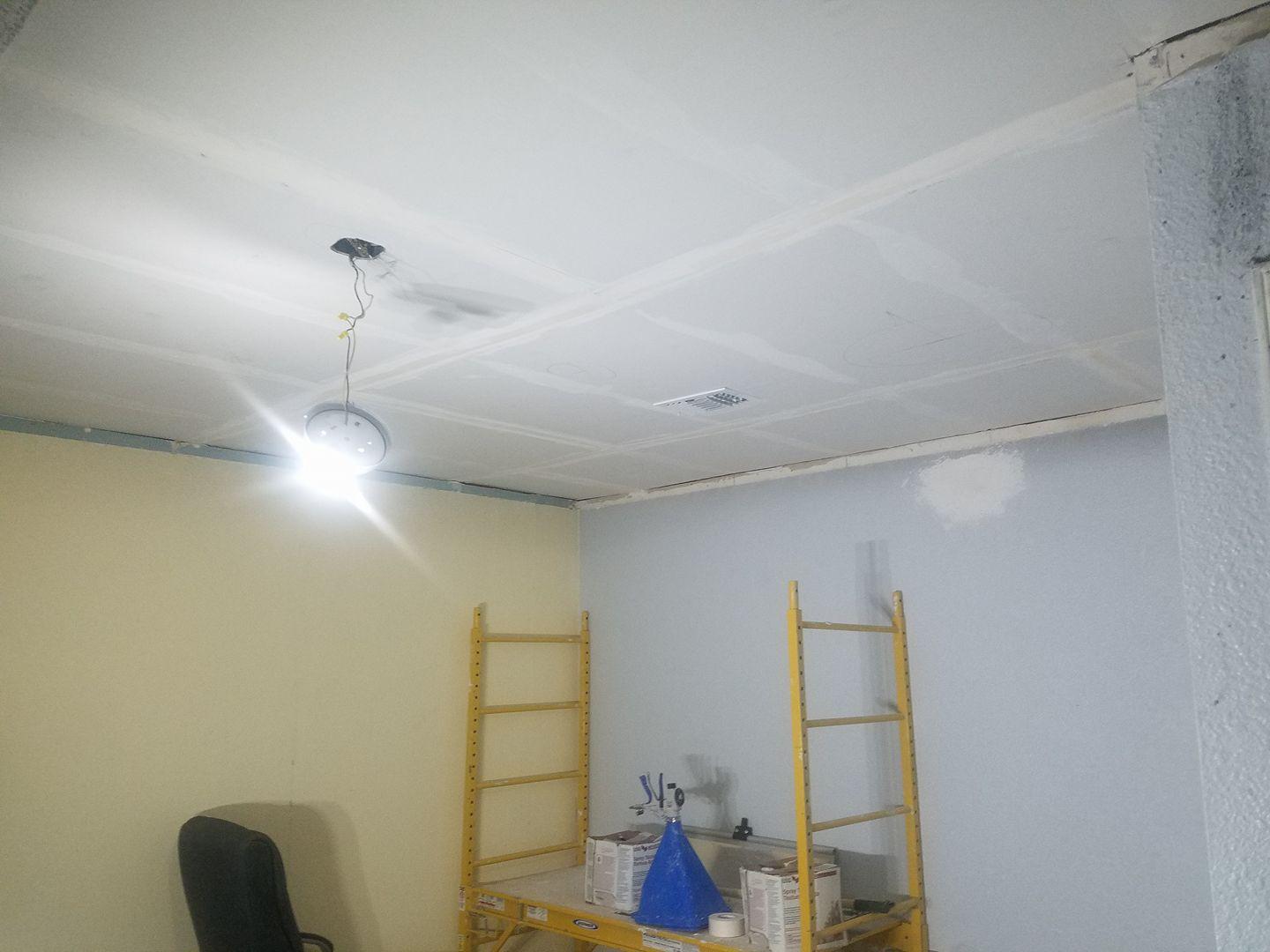 A room with a ceiling that is being remodeled.