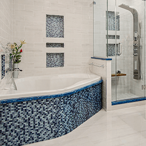 A bathroom with a bathtub and a walk in shower