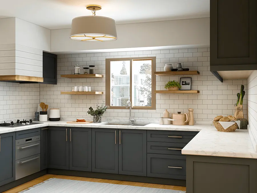 A kitchen with gray cabinets , white counter tops , a sink and a window.