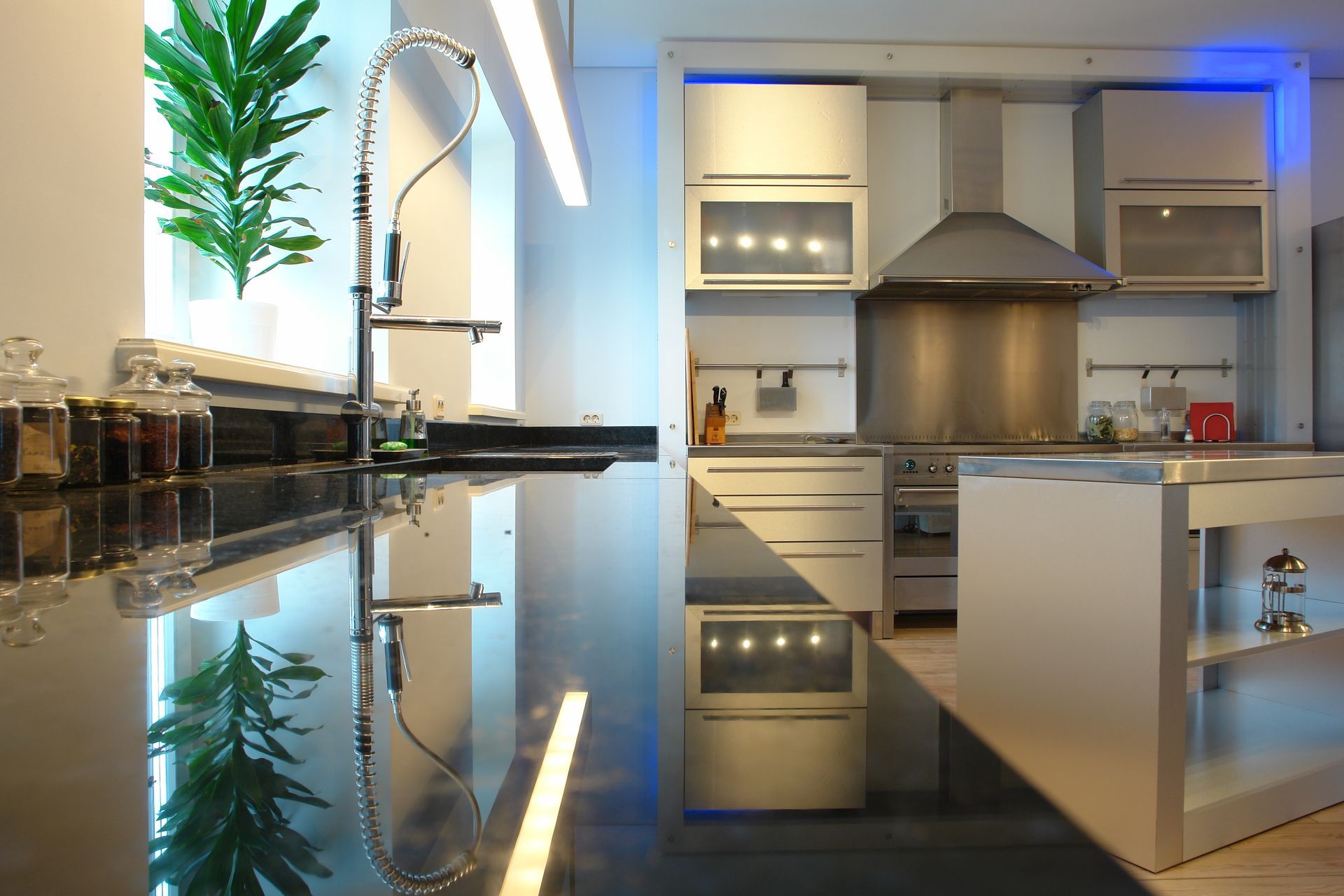 A kitchen with stainless steel appliances and a sink