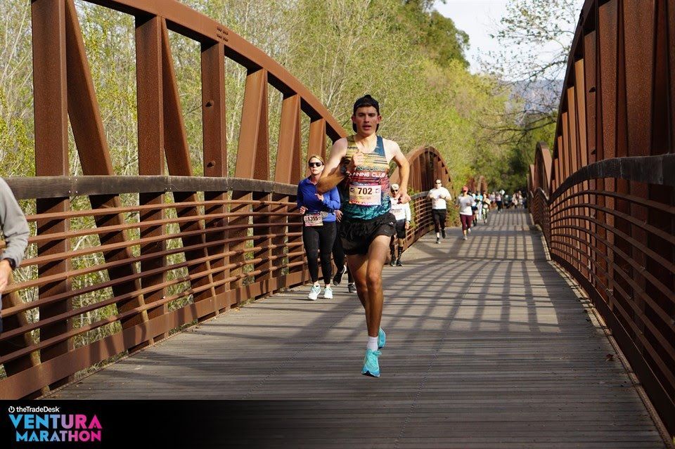 Ventura Marathon - Race Winner Garrett Reynolds running over the bridge tqwo miles North of Foster Park.