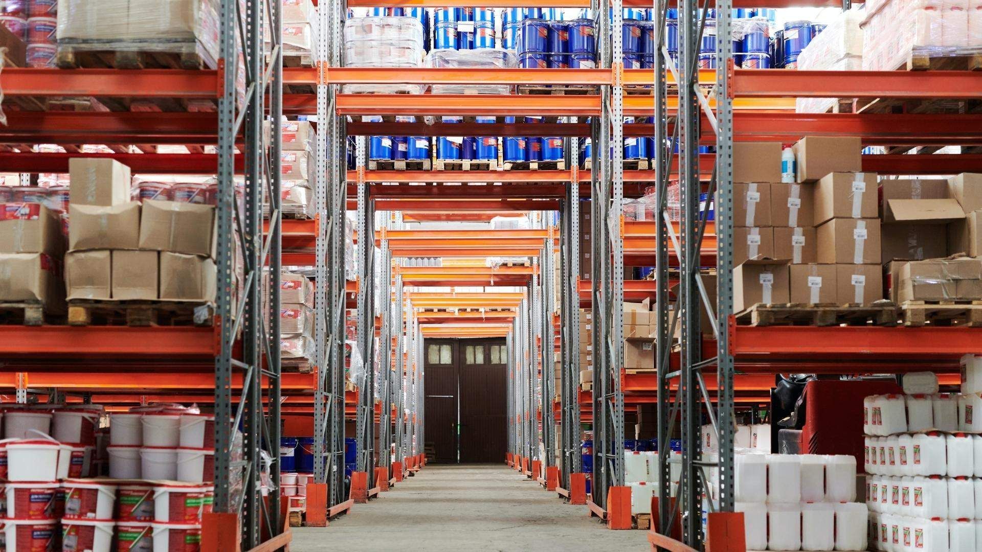 A warehouse filled with lots of boxes and shelves.