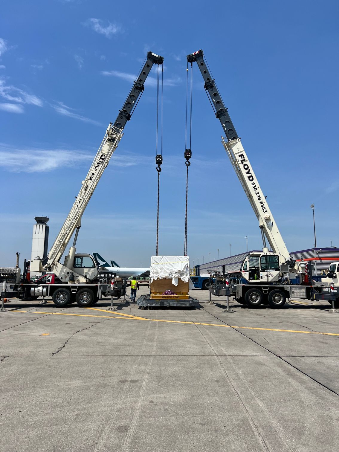 Mobile hydraulic truck crane on a commercial job site for crane rental.