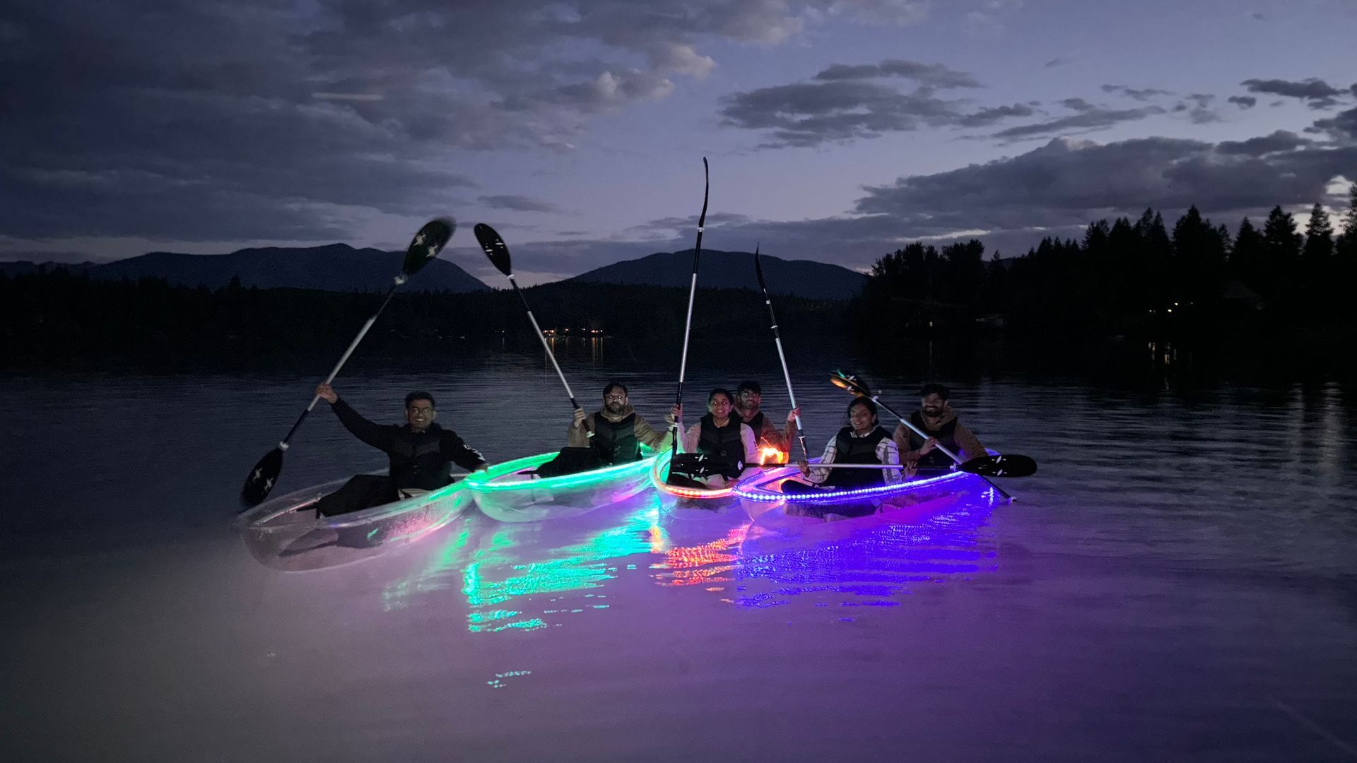 Kayaking under the night sky near Glacier Park with friends in illuminated glass kayaks. A magical experience you'll never forget. ?? #KayakAdventures #GlacierPark #NightPaddle
