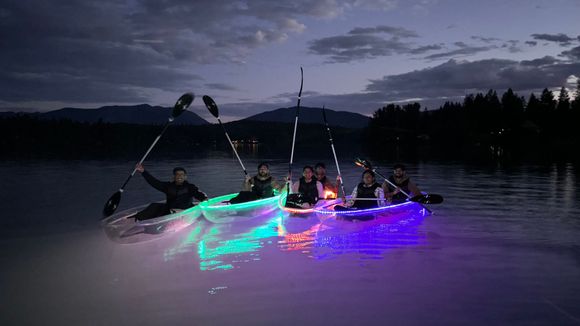 Kayaking under the night sky near Glacier Park with friends in illuminated glass kayaks. A magical experience you'll never forget. ?? #KayakAdventures #GlacierPark #NightPaddle