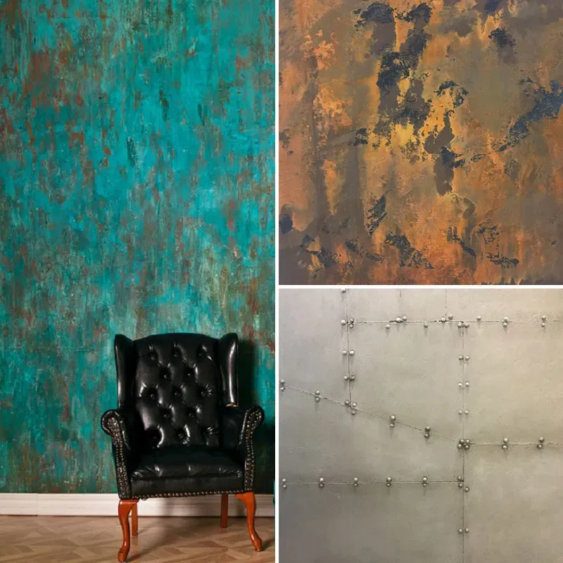 Black leather chair against teal wall beside two abstract textured wall panels