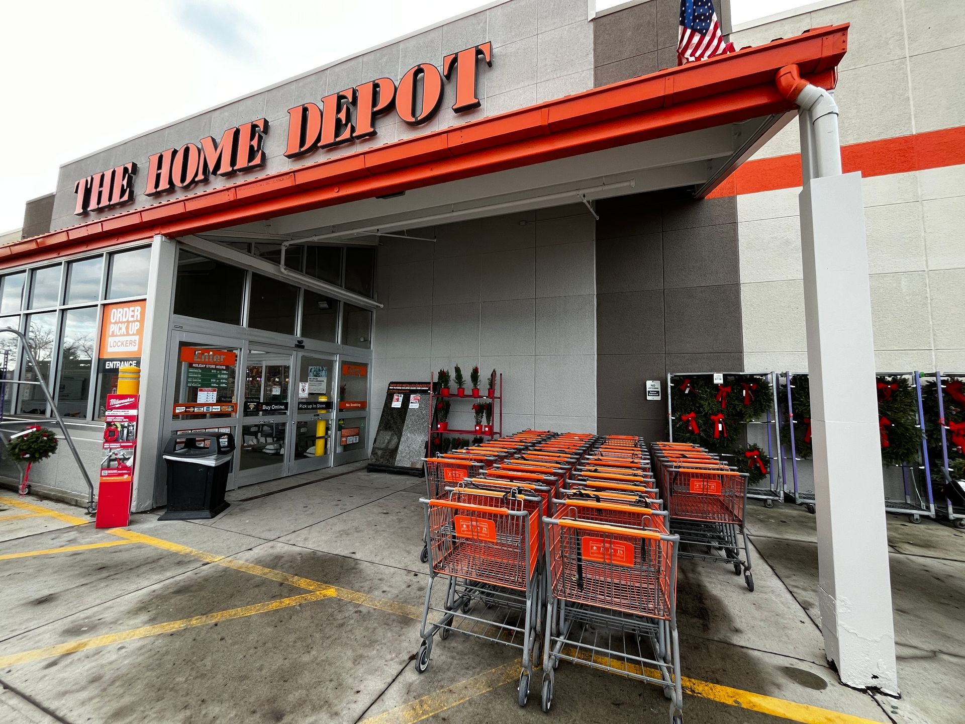 Home Depot storefront with shopping carts lined up at the entrance