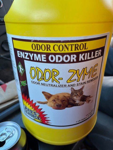 A bottle of odor control enzyme odor killer