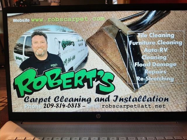 Robert 's carpet cleaning and installation is advertised on a laptop screen