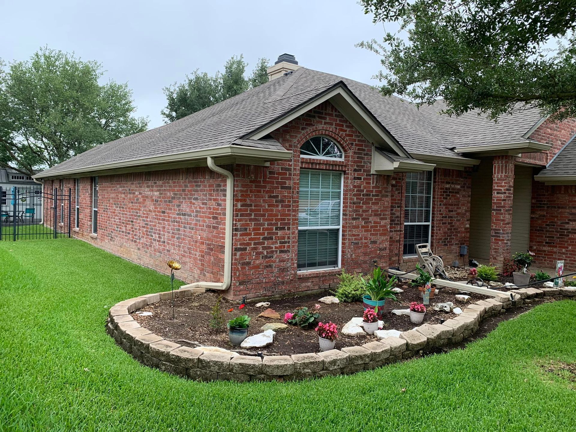 raised garden bed on corner of house