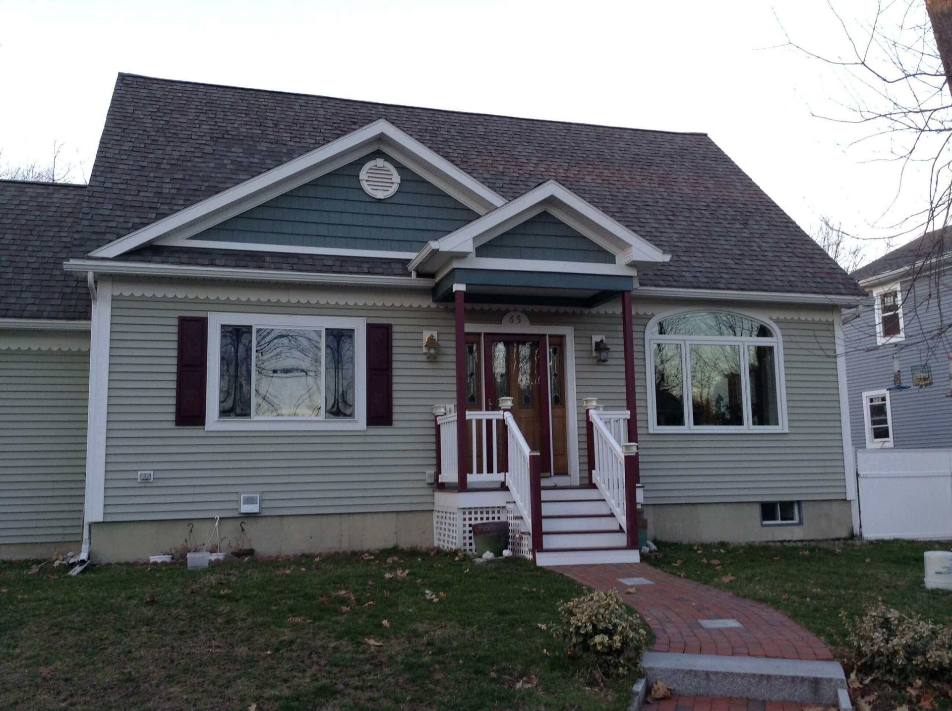 The front of a house with a porch and stairs