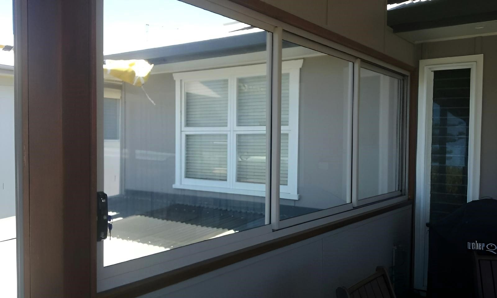 A House with A Lot of Windows and A Door — Grainger Windows & Doors in Ballina, NSW