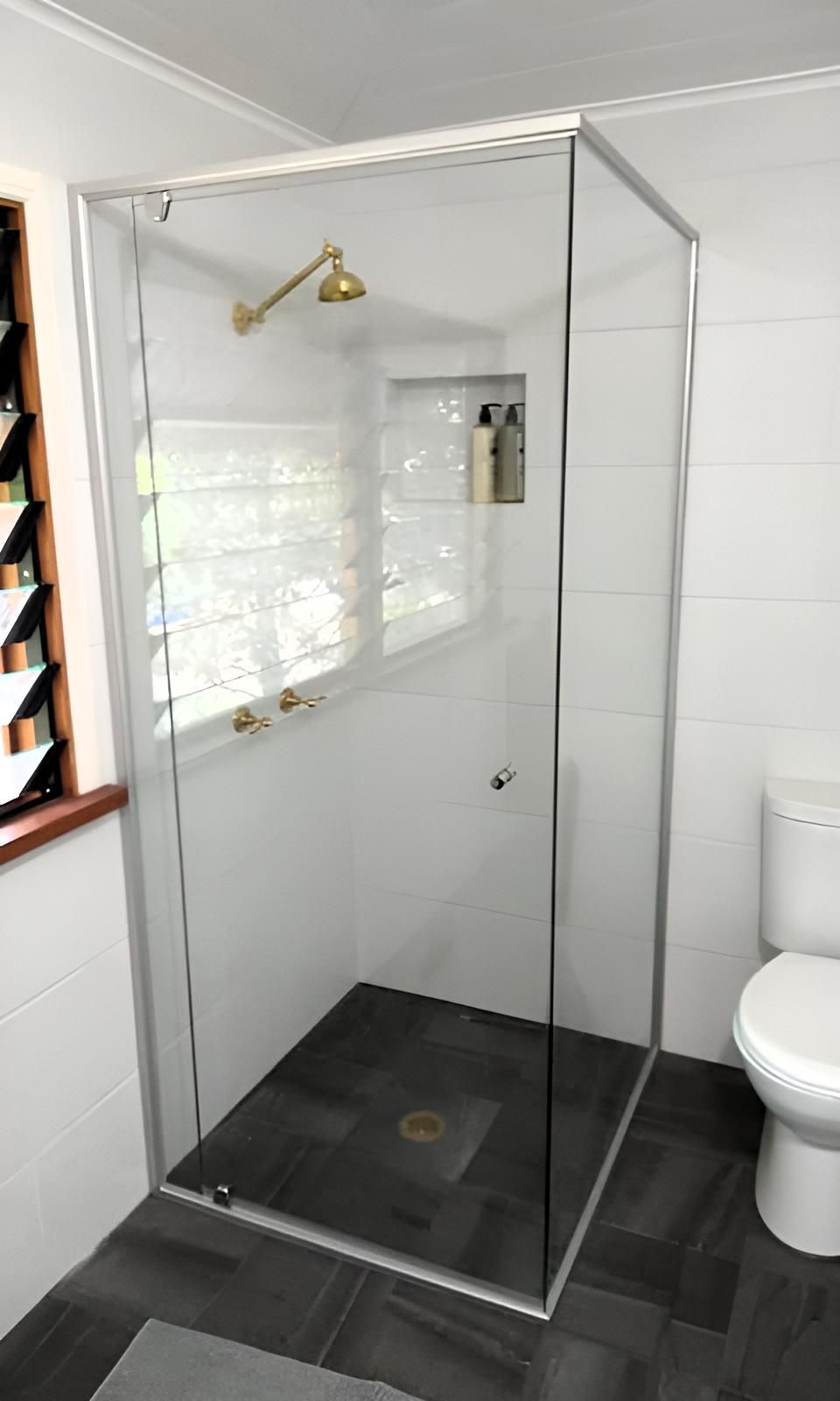 A Bathroom with A Walk in Shower and A Toilet — Grainger Windows & Doors in Wollongbar, NSW
