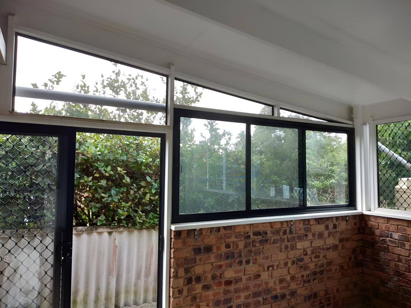 A Room with A Lot of Windows and A Brick Wall — Grainger Windows & Doors in Ballina, NSW