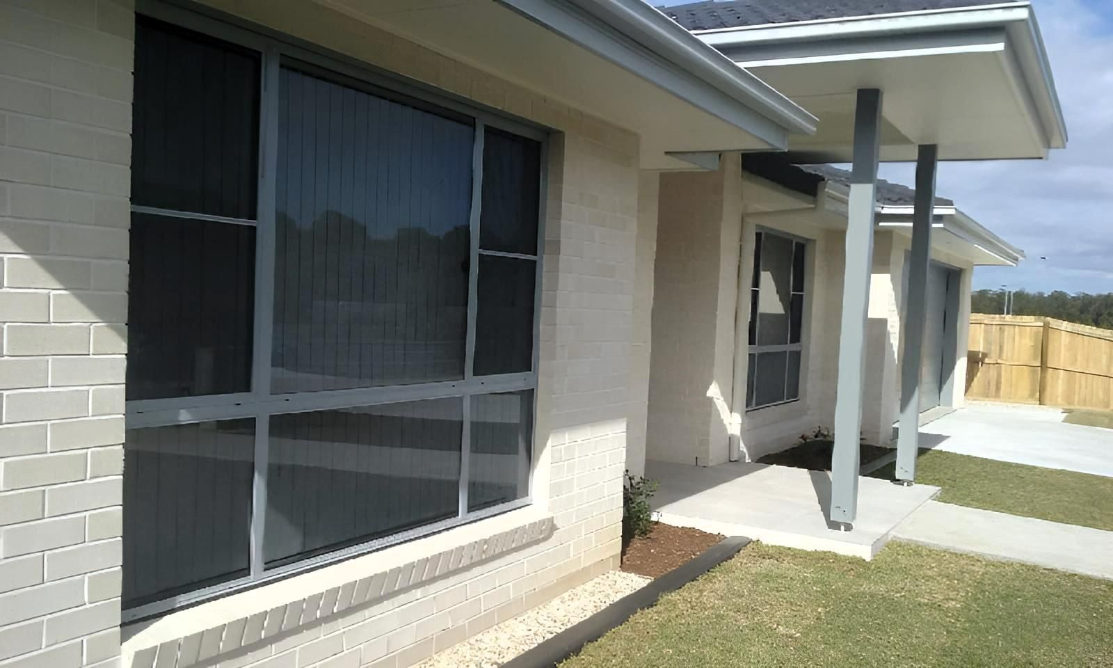A House with A Porch and A Lot of Windows — Grainger Windows & Doors in Lennox Head, NSW