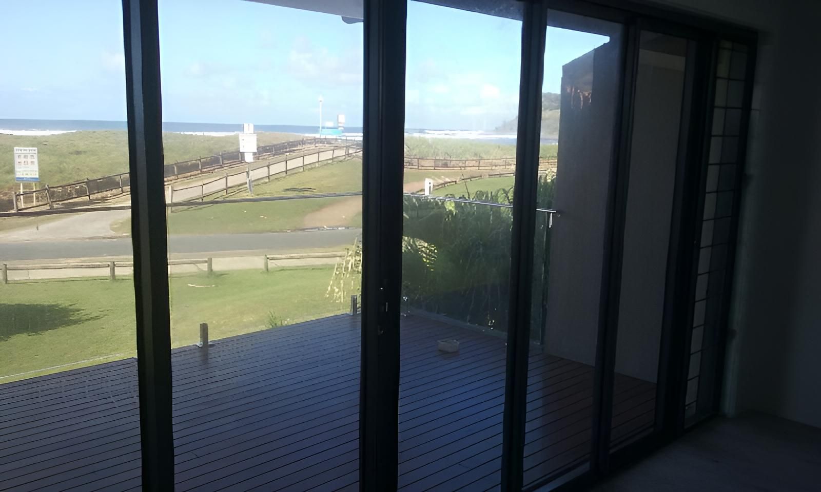A Room with A View of The Ocean Through Sliding Glass Doors — Grainger Windows & Doors in Lennox Head, NSW