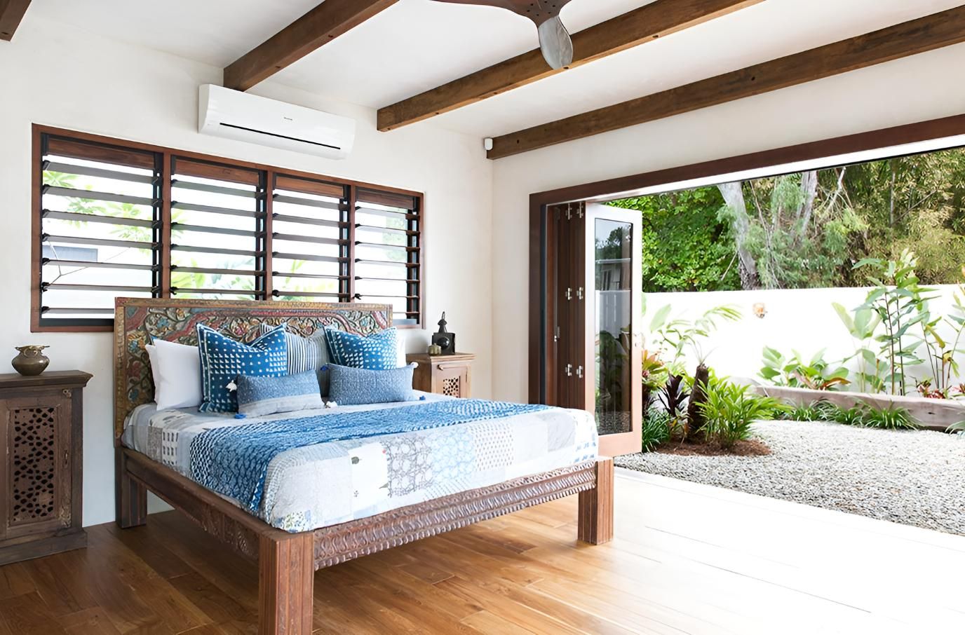 A Bedroom with A King Size Bed and A Ceiling Fan — Grainger Windows & Doors in Lennox Head, NSW