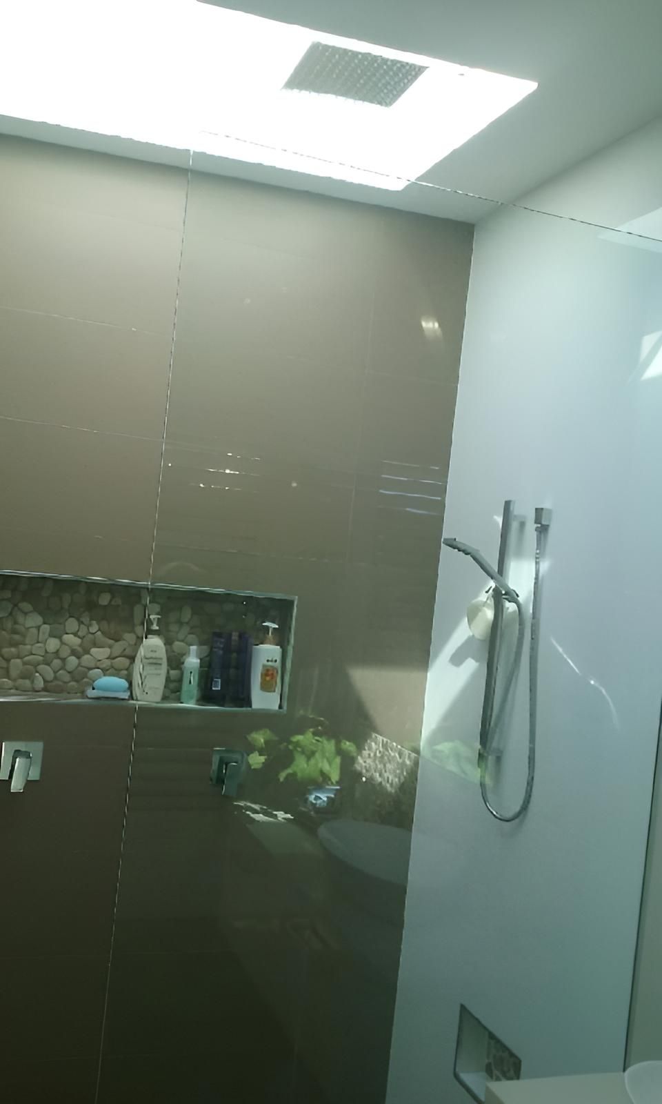 A Bathroom with A Shower, Sink and Toilet — Grainger Windows & Doors in Alstonville, NSW