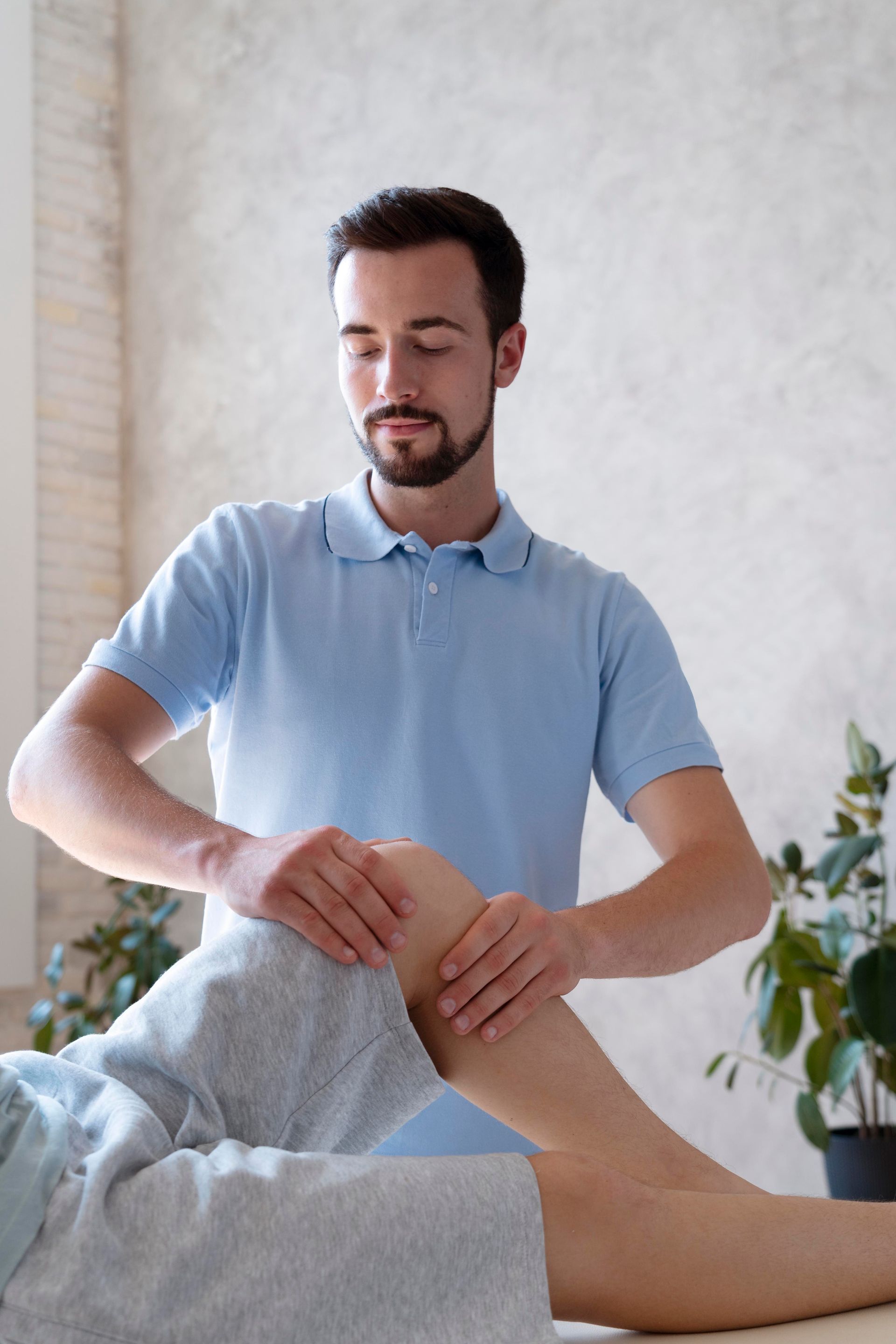 physiotherapist-massaging-patient-close-up.