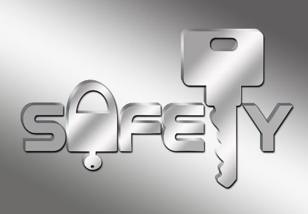 Silver “SAFETY” text with a key forming the letter Y on a gray background