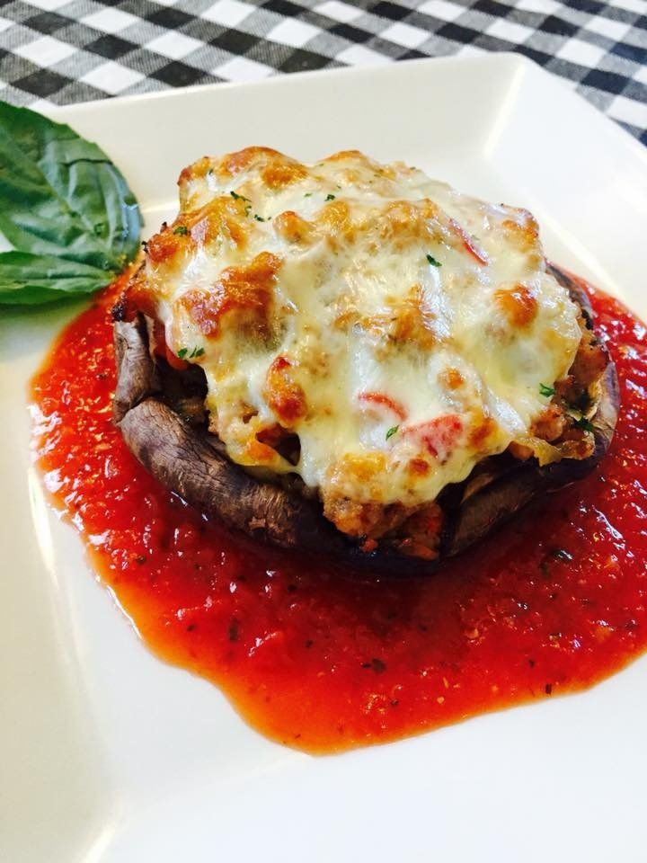large stuffed mushroom with sauce and cheese
