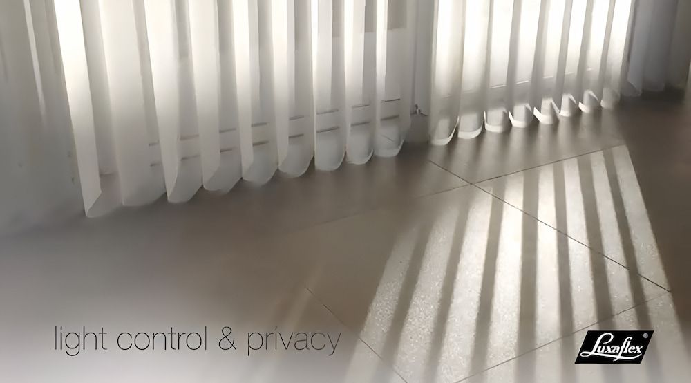Sunlight Streams Through Vertical Blinds, Casting Striped Shadows on a Wood Floor — BlindDESIGN in Ballina, NSW