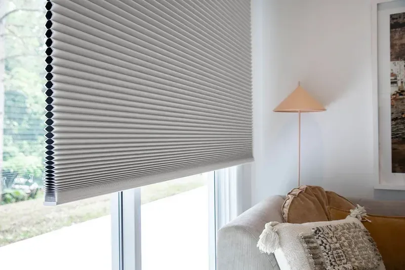 Gray Cellular Shade Covers a Window in a Bright Room — BlindDESIGN in Byron Bay, NSW