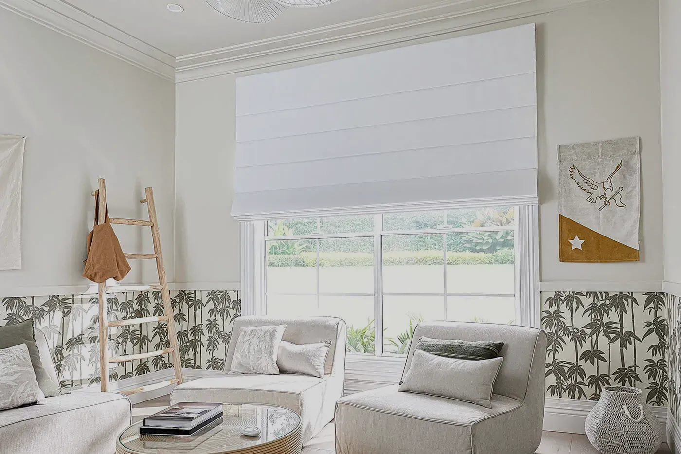 A Bright White Living Room With a Window, White Blinds, and Light-coloured Furniture — BlindDESIGN in Tweed Heads, NSW