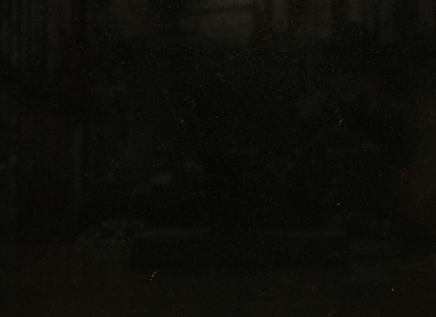 Un fondo negro con algunos puntos blancos.