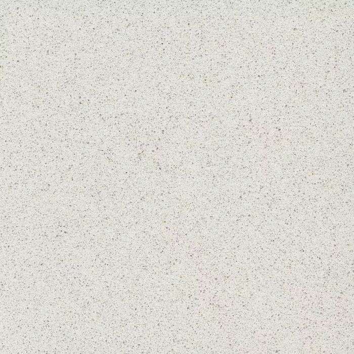 Un primer plano de una superficie blanca con pequeños puntos.