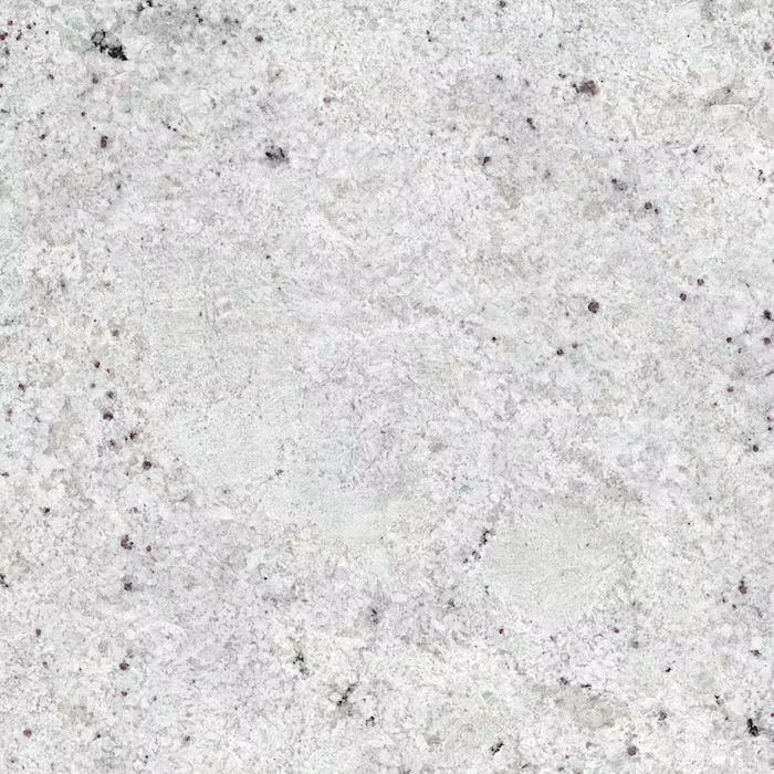 Un primer plano de una encimera de granito blanco.