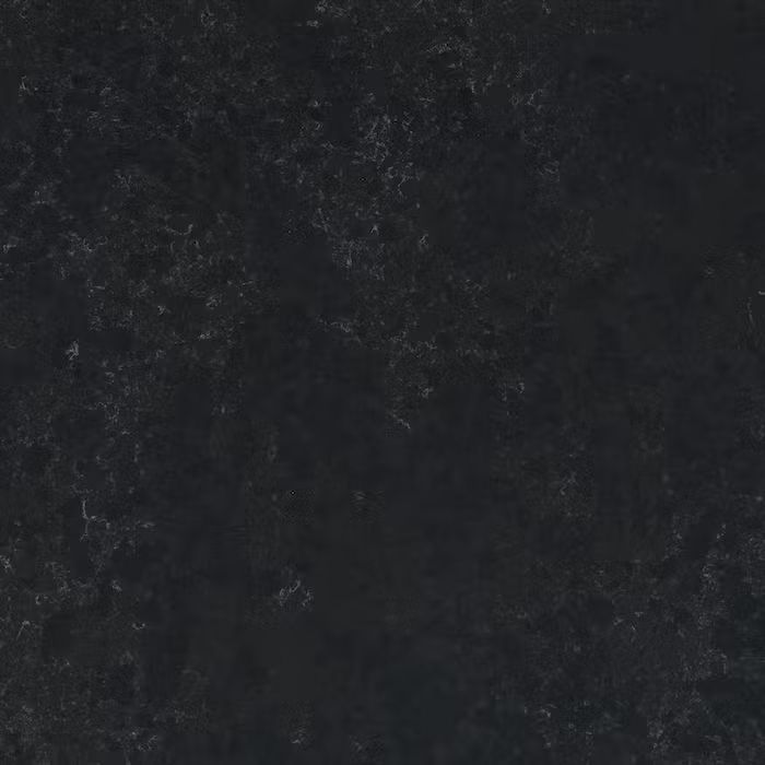 Un primer plano de un azulejo negro con textura granulada.