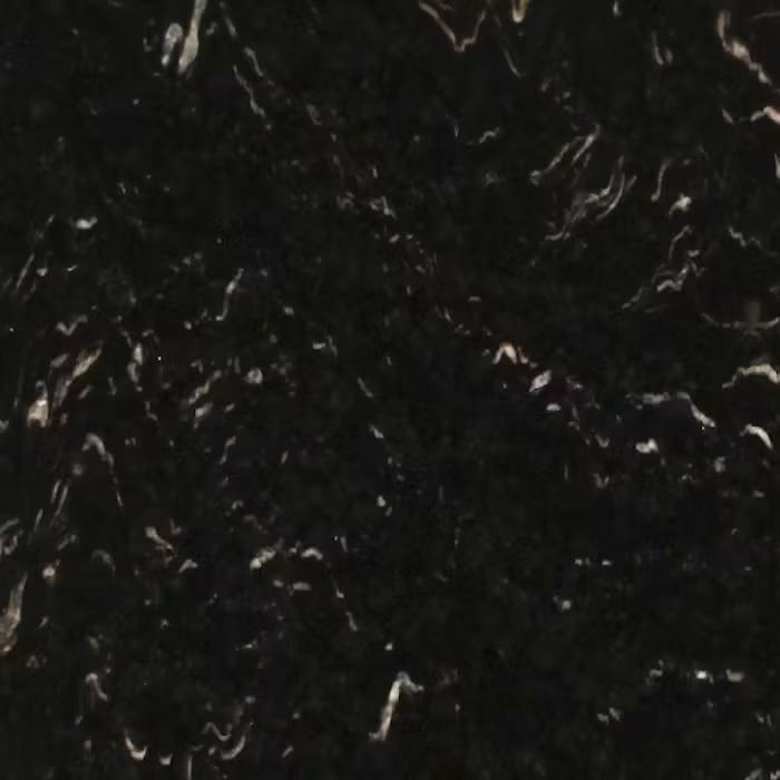 Un primer plano de una superficie negra con manchas blancas.