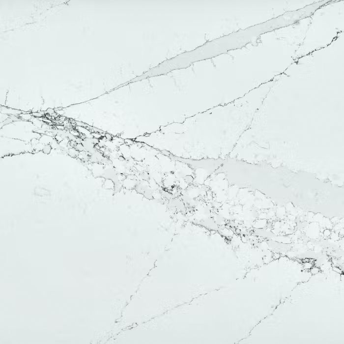 Un primer plano de una encimera de mármol blanco.