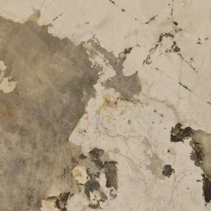 Un primer plano de una textura de mármol con muchas manchas.