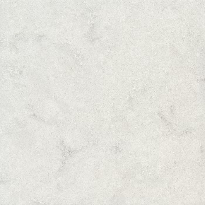 Un primer plano de un azulejo blanco con textura de mármol.