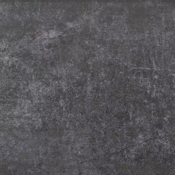 Un primer plano de un azulejo negro con textura gris.